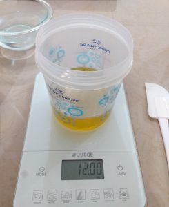 Weighing oils for activated charcoal soap