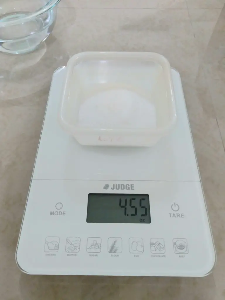 Weighing sodium hydroxide for soapmaking