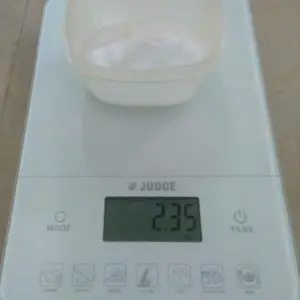 weighing sodium hydroxide to make lemongrass soap