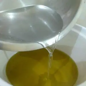 Adding lye solution to oils
