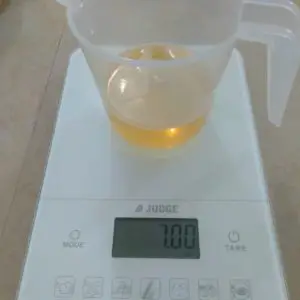 Weighing oils to make lemongrass soap