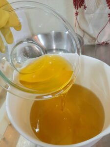 Pouring Ghee into Oils