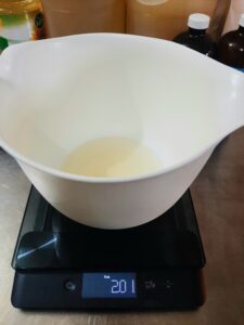 Weighing castor oil