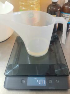 Weighing oils to make peppermint and tea tree soap