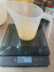 Weighing oils to make peppermint and tea tree soap