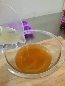 Pouring Oils into Beeswax and Butters